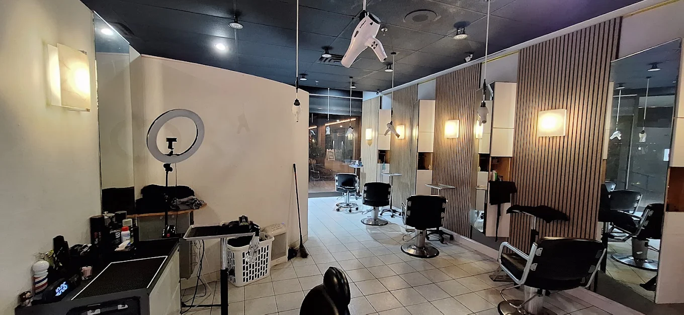 Styling stations with wood-slat mirrors and warm lighting